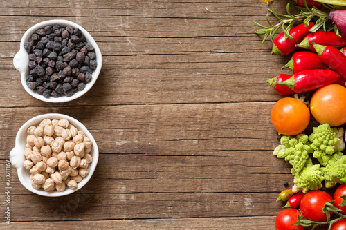 Vegetables and chickpea on a wooden table