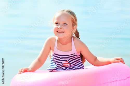 happy laughing girl and swim ring © Kostiantyn