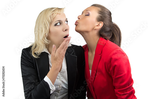 Woman trying kiss enother woman photo