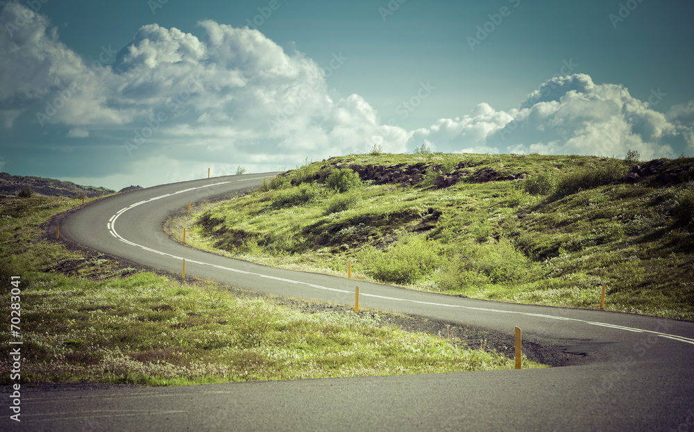 Curved asphalt road in high mountains of Iceland Stock Photo | Adobe Stock