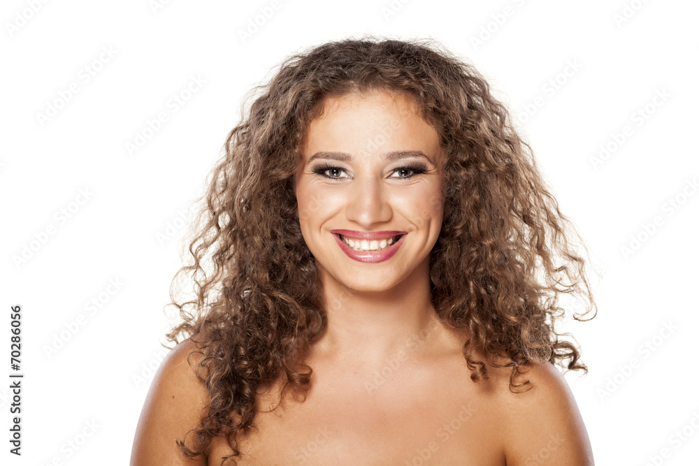happy and smiling young woman with curly hair happy and smiling young woman with curly hair