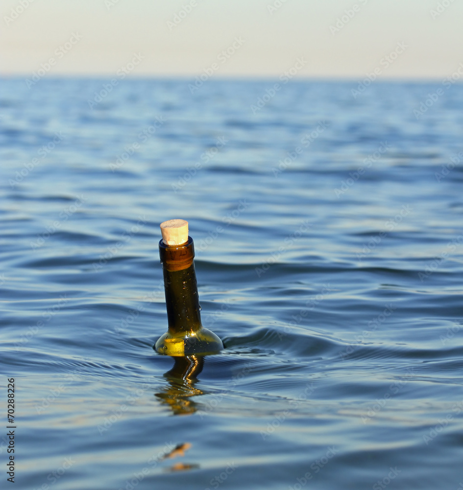 bottle with a secret message in the middle of the ocean bottle with a secret message in the middle of the ocean