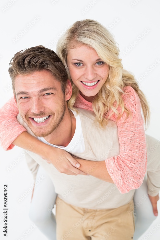 Portrait of a man piggybacking woman