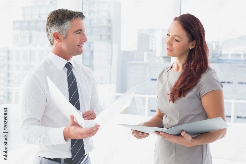 Business people smiling and talking Business people smiling and talking