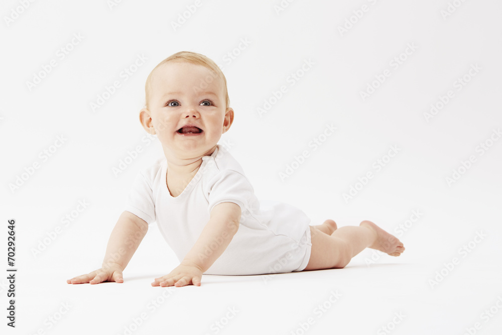 Young baby girl crawling on front, studio. Young baby girl crawling on front, studio.