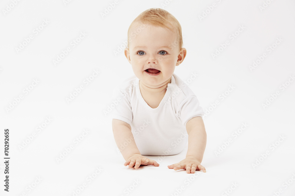 Young baby girl crawling on front, studio. Young baby girl crawling on front, studio.