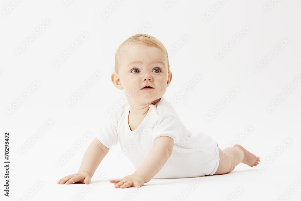 Young baby girl crawling on front, studio. Young baby girl crawling on front, studio.