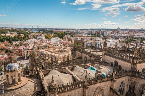 Dome and roof of Seville Cathedral and view of city of Seville