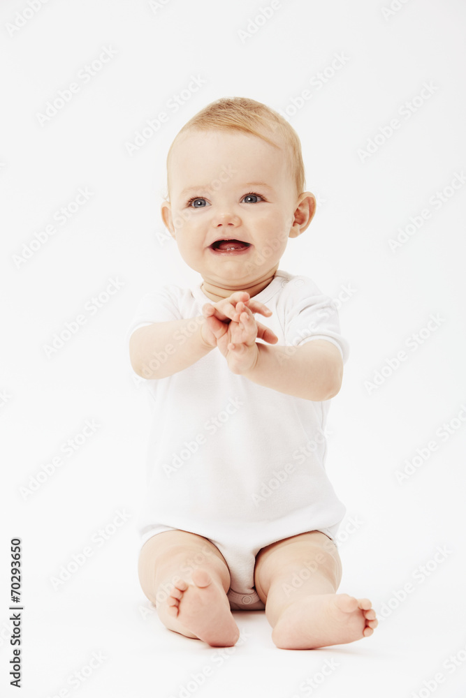 Young baby girl with clasped hands, studio. Young baby girl with clasped hands, studio.