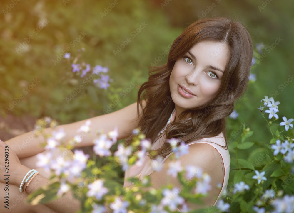 beautiful woman in park with flowers beautiful woman in park with flowers
