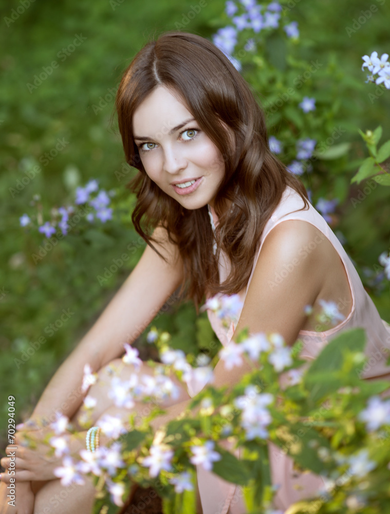 beautiful woman in park with flowers beautiful woman in park with flowers