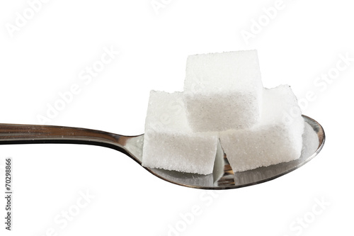 Würfelzucker auf Löffel
