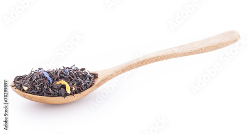 Earl grey tea with calendula, cornflowers in the wooden spoon