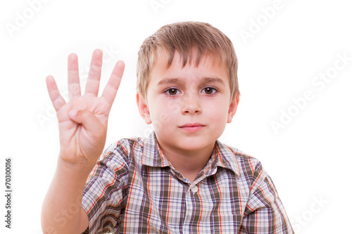 child portrait, schoolboy showing numbers with hand - isolated
