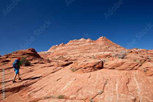 USA - man in coyote buttes recreational park - The wave