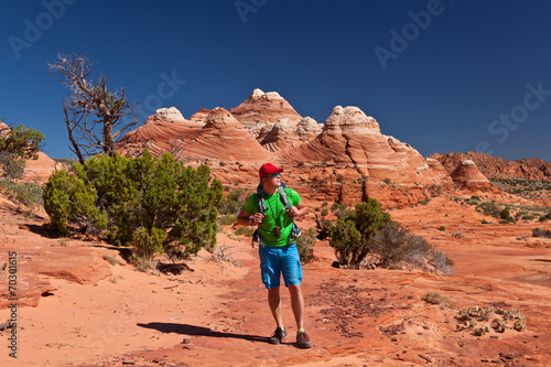 USA - man in coyote buttes recreational park - The wave