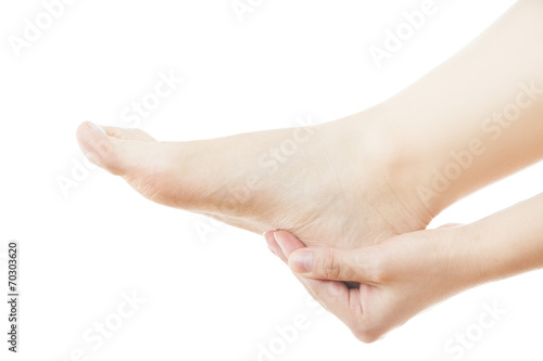 Massage of female feet isolated on white background © staras