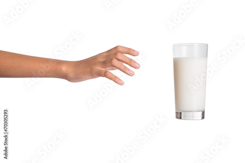 Young girl hand with a glass of milk
