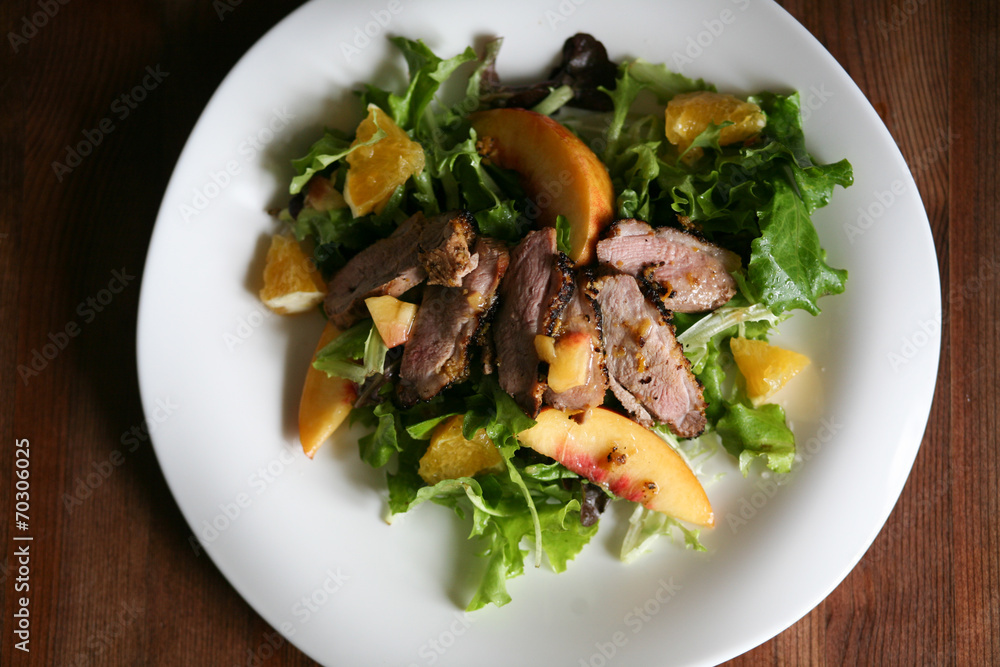 Salad with roasted duck breast and orange