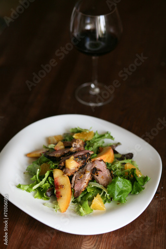 Salad with roasted duck breast and orange