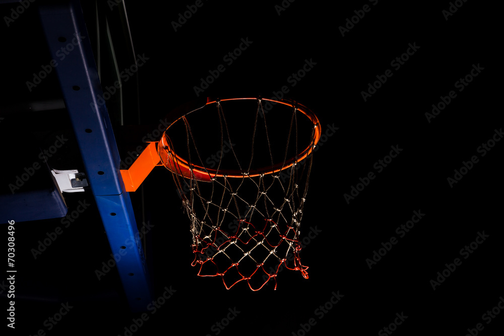Fototapeta Basketball hoop on black background with light effect