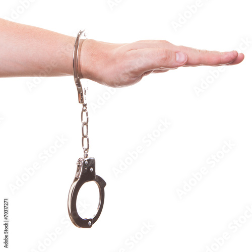 male hand in police handcuffs showing gesture isolated