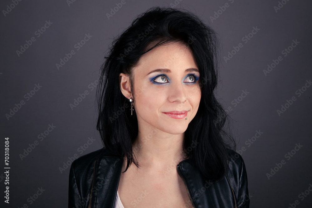 pretty girl in leather jacket with piercings smiling pretty girl in leather jacket with piercings smiling
