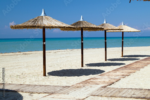 Umbrellas on perfect tropical beach