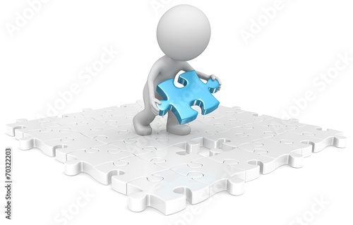 Last piece.The dude putting last puzzle blue piece in assembly.