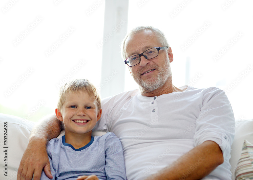 smiling grandfather and grandson at home smiling grandfather and grandson at home