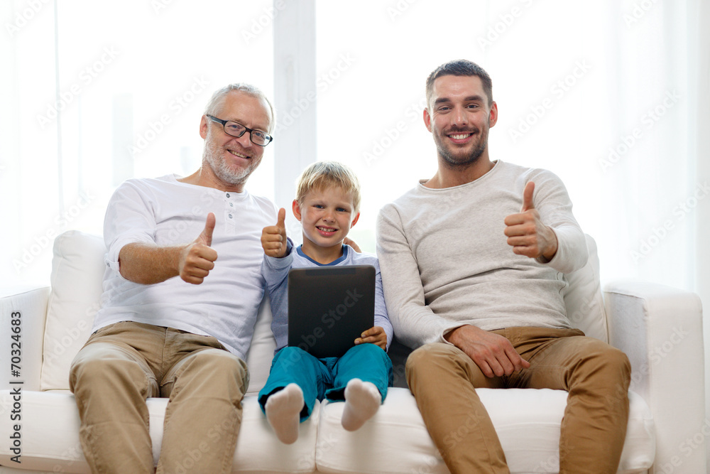 smiling family with tablet pc at home