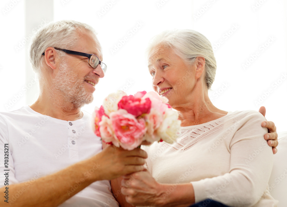 happy senior couple with bunch of flowers at home happy senior couple with bunch of flowers at home