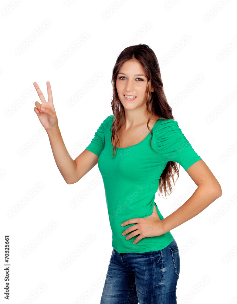 Attractive casual girl in green making the sign of victory Attractive casual girl in green making the sign of victory