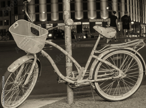 BERLIN - MAY 28, 2012: Bicycle and tourists in city streets. Mor photo