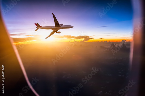 Canvas Print Airplane in the sky at sunrise