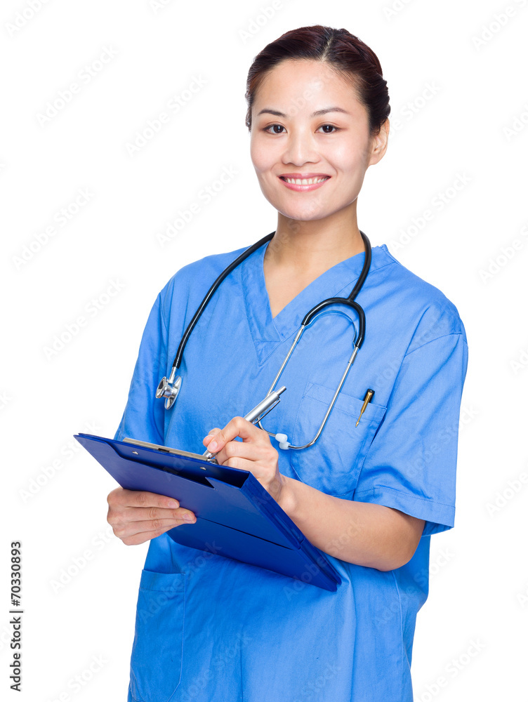 Female doctor write on clipboard Female doctor write on clipboard
