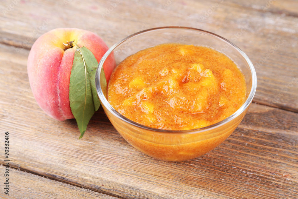 tasty peach jam with fresh peaches on wooden table tasty peach jam with fresh peaches on wooden table