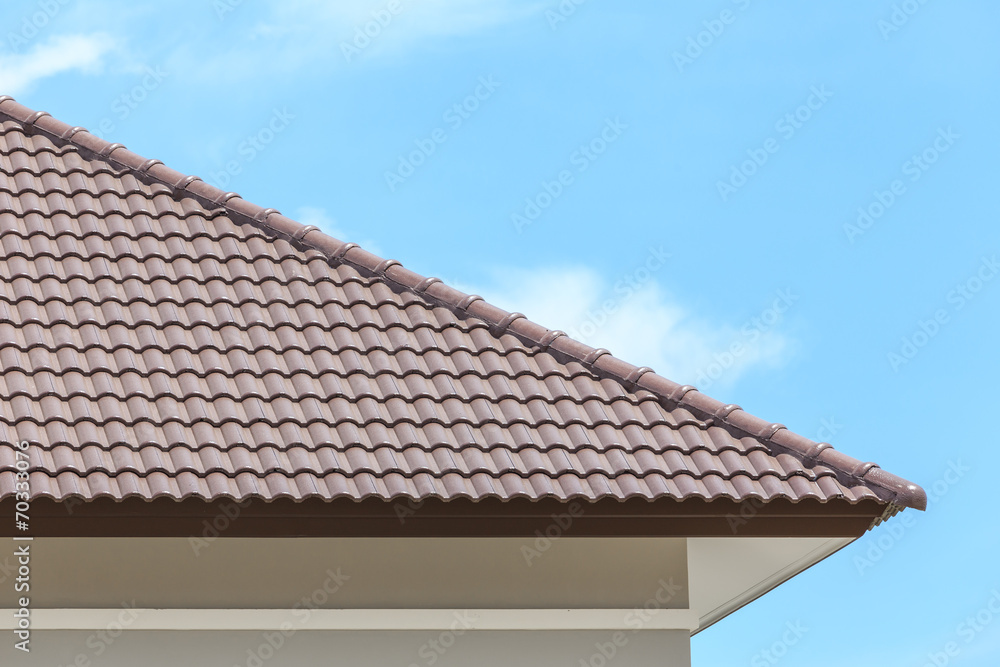 roof under construction with stacks of roof tiles for home build