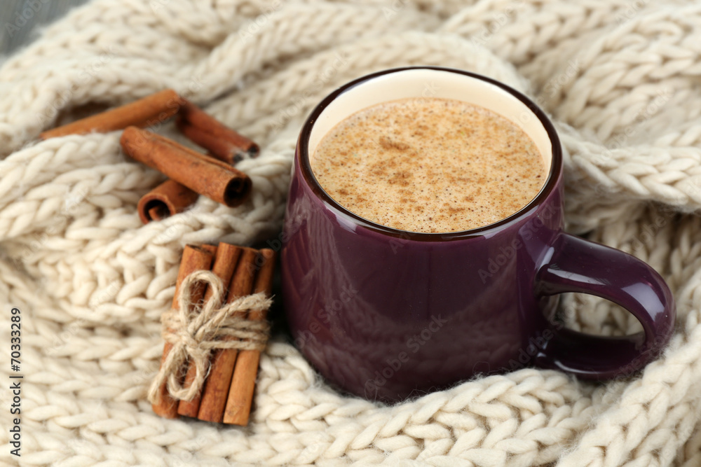 Milk with cinnamon on wooden table Milk with cinnamon on wooden table