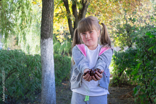 little girl with chestnuts