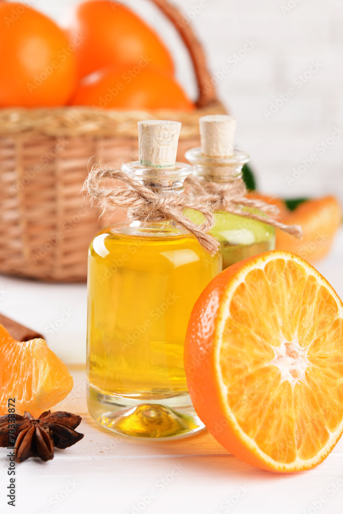 Tangerine oil on table on light background Tangerine oil on table on light background