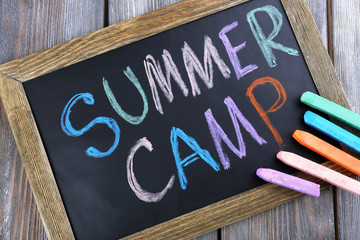 Text Summer camp written with chalk
