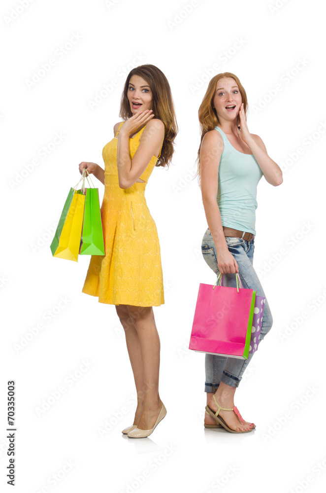 Friends with shopping bags isolated on white Friends with shopping bags isolated on white