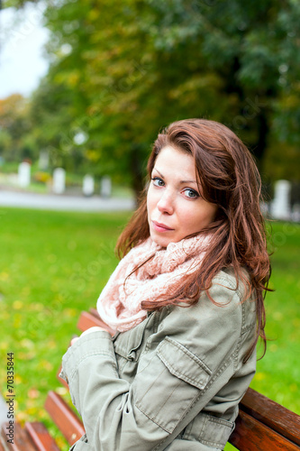 woman sitting bench outside