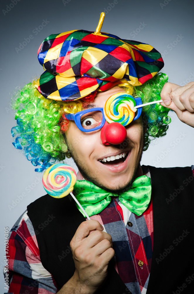 Funny clown with sweet lollipop Funny clown with sweet lollipop