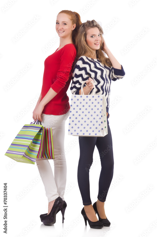 Friends with shopping bags isolated on white Friends with shopping bags isolated on white