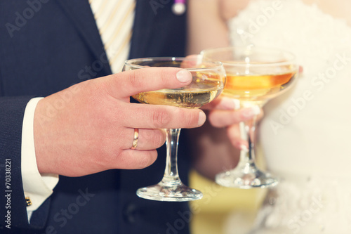 wine glasses in hand bride and groom.