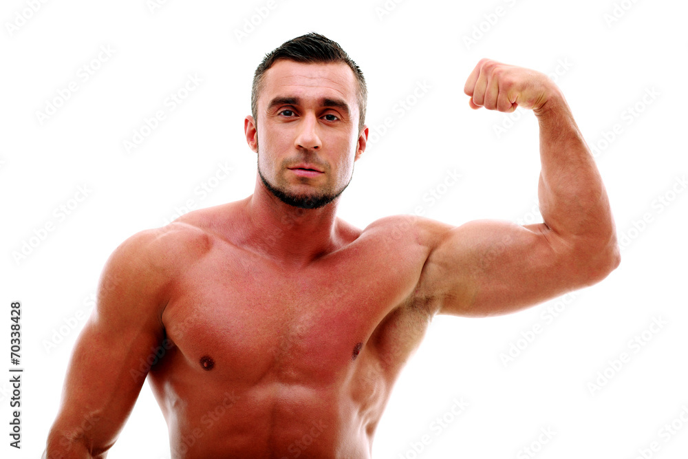 Muscular man showing his biceps isolated on white background Muscular man showing his biceps isolated on white background