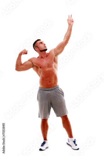 Handsome sportsman posing over white background