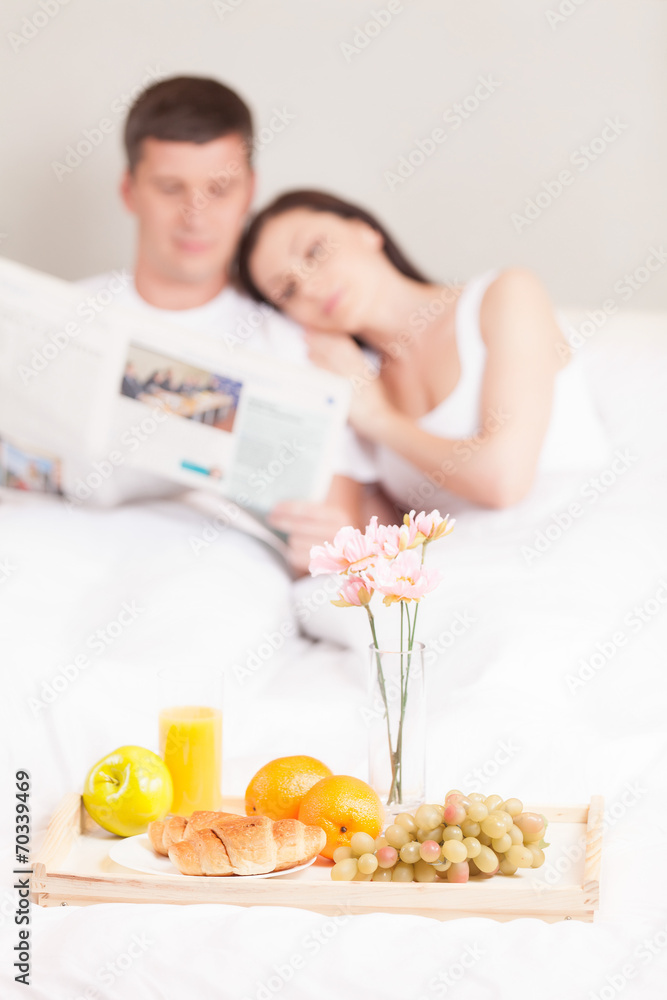 Beautiful young couple having breakfast.